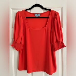 Women’s bright orange top. Detailed sleeves. CeCe brand. Size large. Really cute